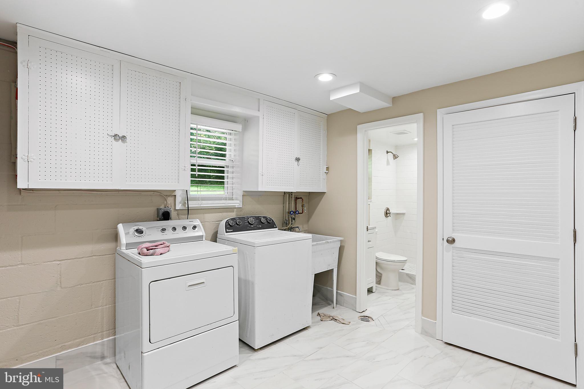 4113 Weller Road Silver Spring, MD 20906 - Photo 26 of 35 a utility room with closet dryer and washer