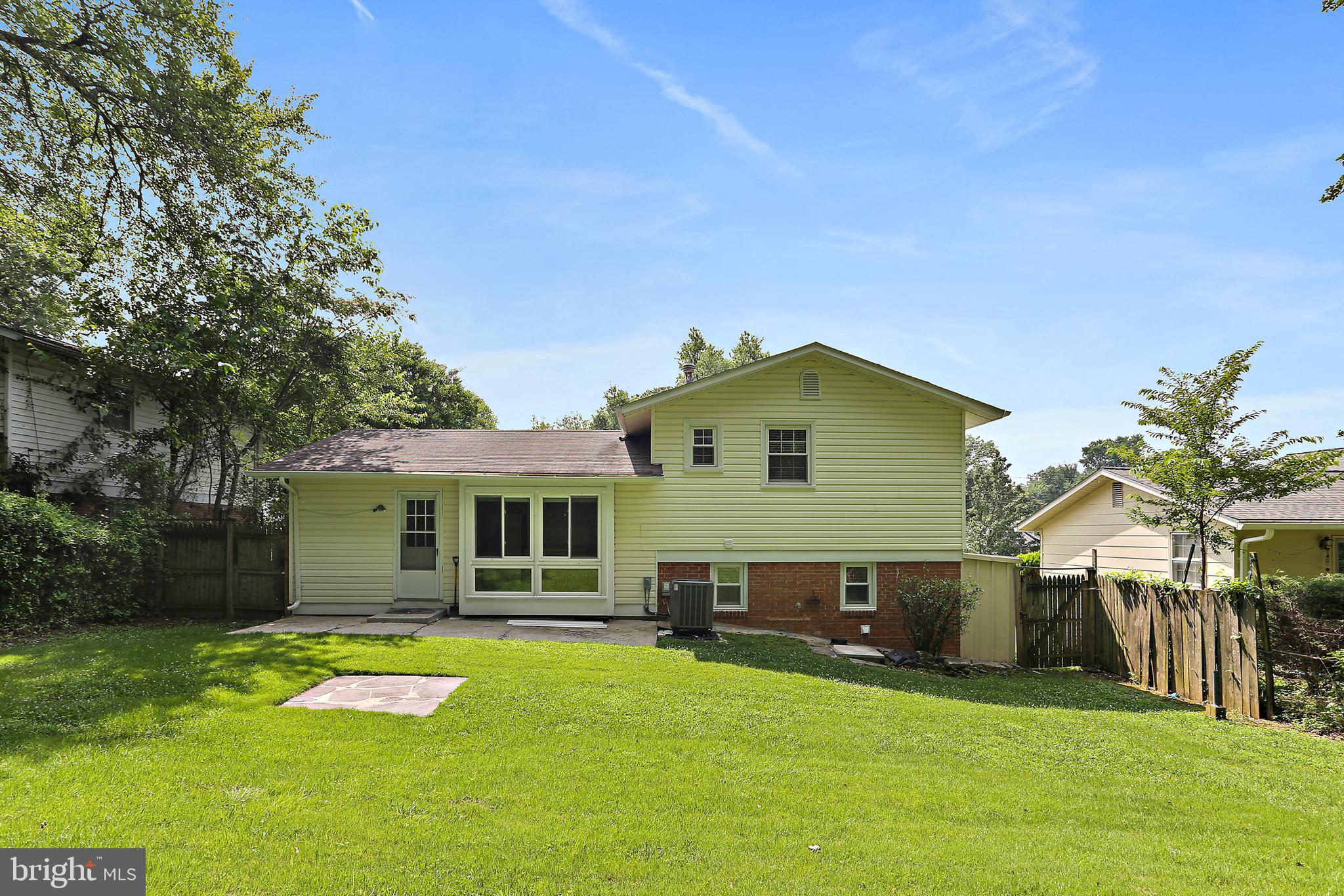 4113 Weller Road Silver Spring, MD 20906 - Photo 31 of 35 a view of a house with a swimming pool and a yard