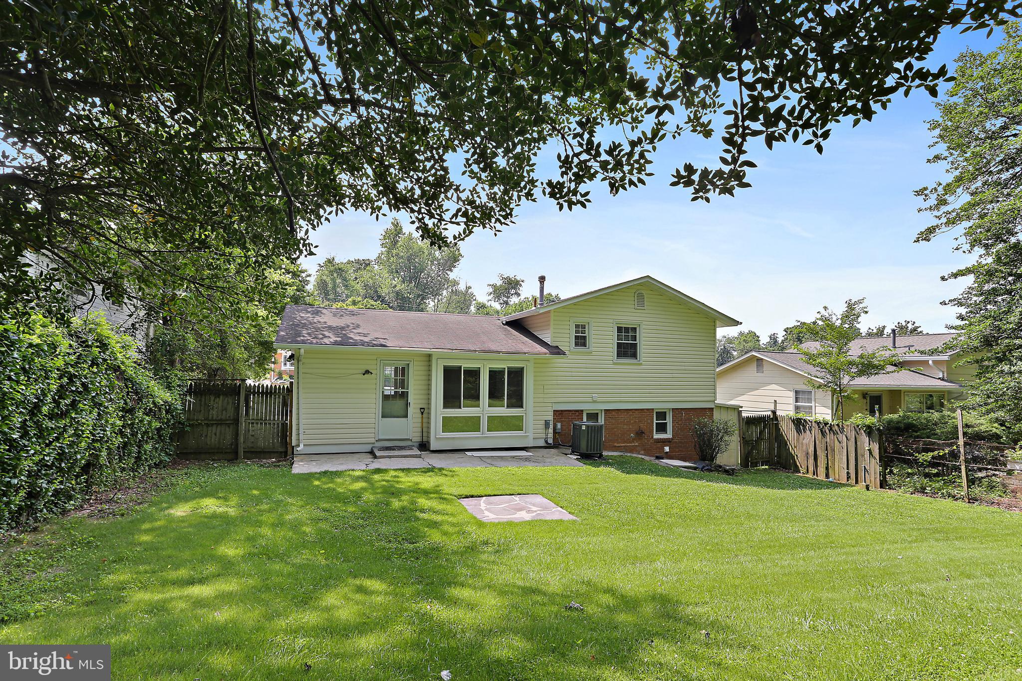 4113 Weller Road Silver Spring, MD 20906 - Photo 32 of 35 a aerial view of a house with a yard table and chairs