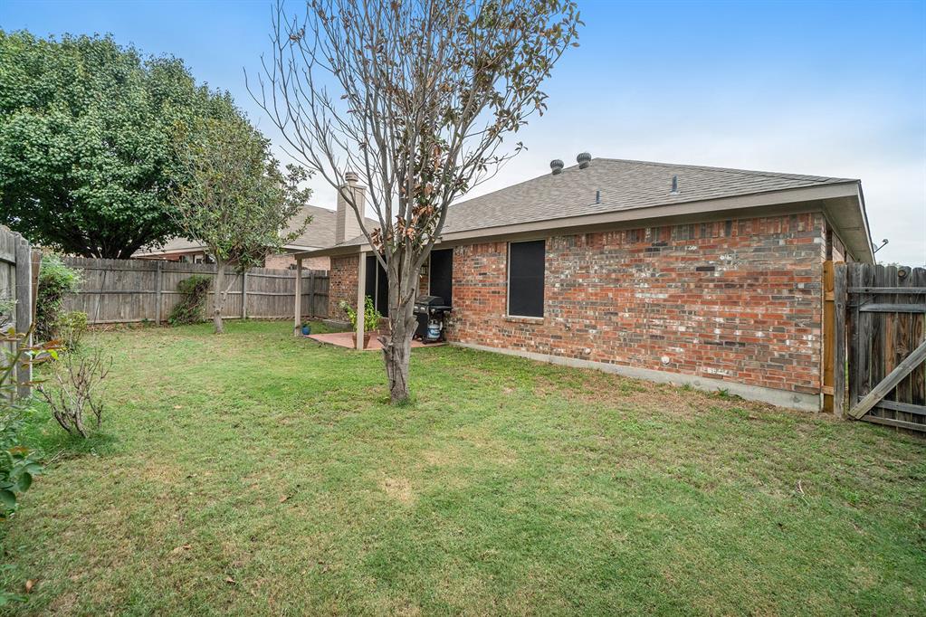 2808 Wakecrest Drive Fort Worth, TX 76108 - Photo 22 of 22 a backyard of a house with lots of green space