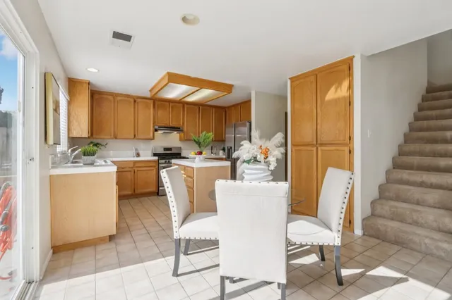 a living room with furniture or couch and a potted plant