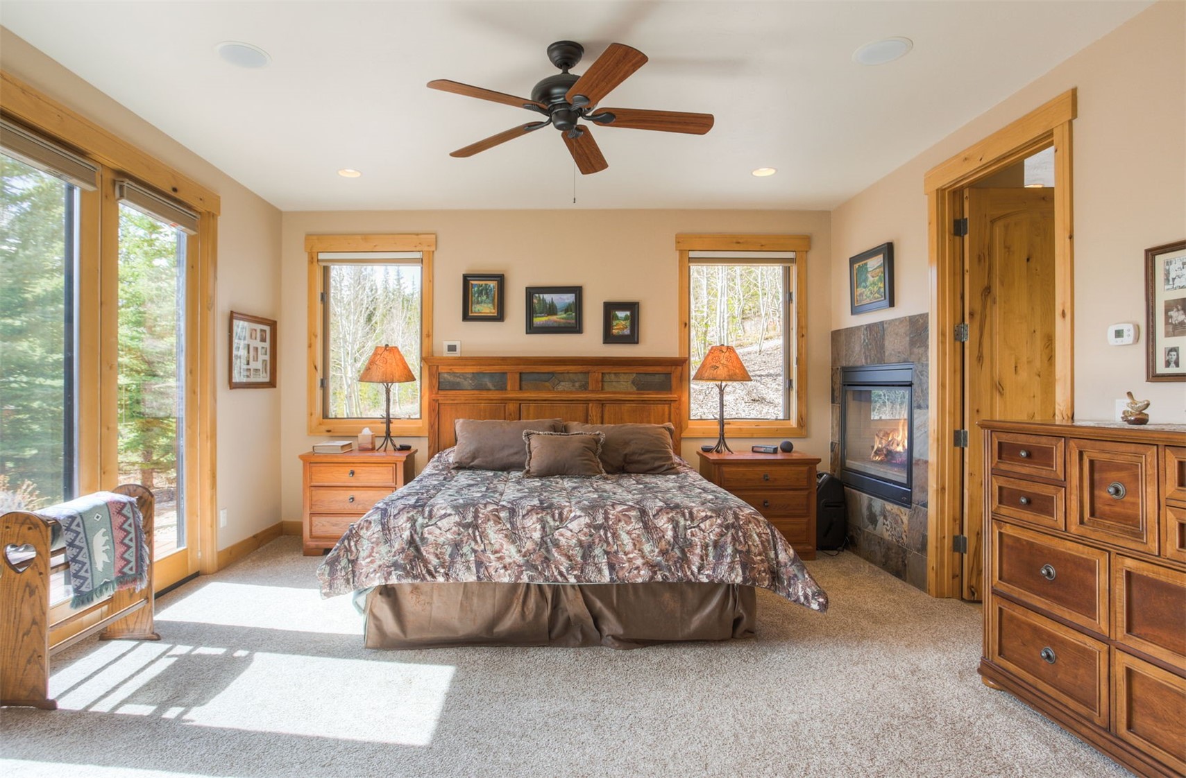 727 Willowbrook Road Silverthorne, CO 80498 - Photo 23 of 47 a bedroom with a bed a dresser and a window