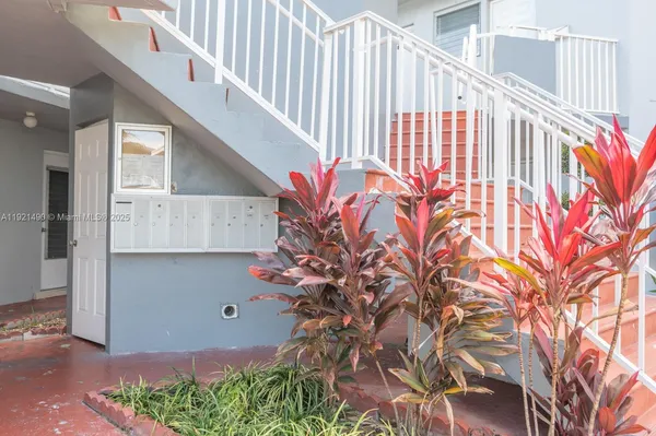 a view of entryway with flower plants