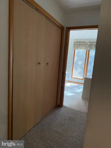 a view of balcony with wooden floor and fence