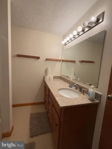 a view of a balcony with wooden floor