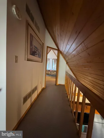a living room with furniture a fireplace and a large window