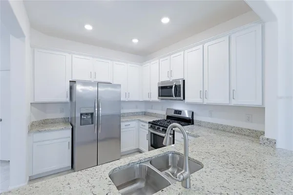 a kitchen with a sink and cabinets