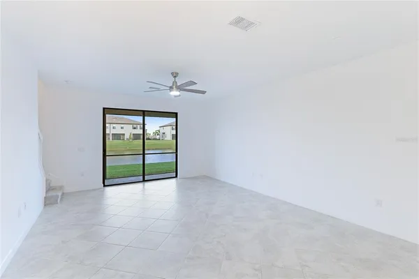 a view of an empty room with a window