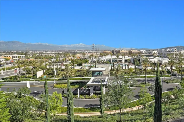 a bathroom with a toilet sink vanity and mirror