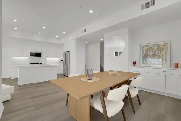 a bedroom with a bed and a table