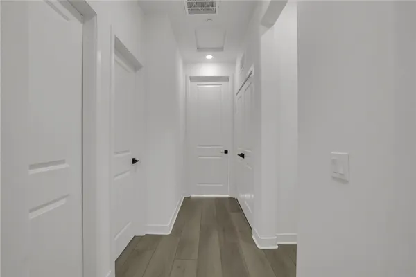 a bedroom with a bed and a table