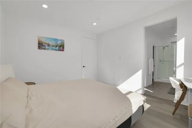 a bedroom with two beds and a window