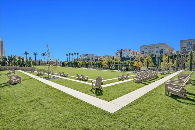a building outdoor space with patio furniture and a potted plant