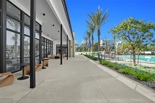 a view of living room filled with furniture and a potted plant