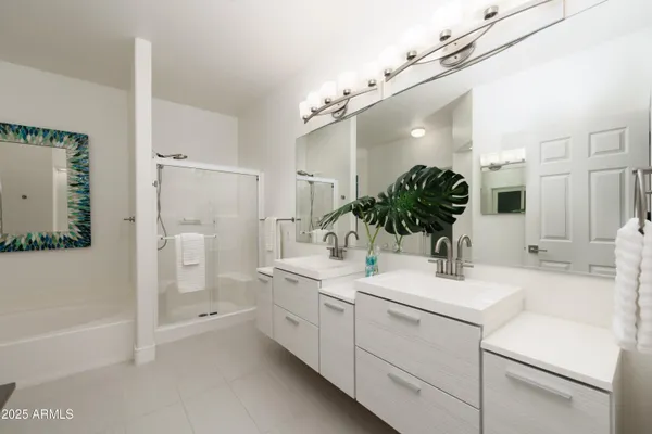 a bathroom with a sink a faucet a mirror and a bathtub