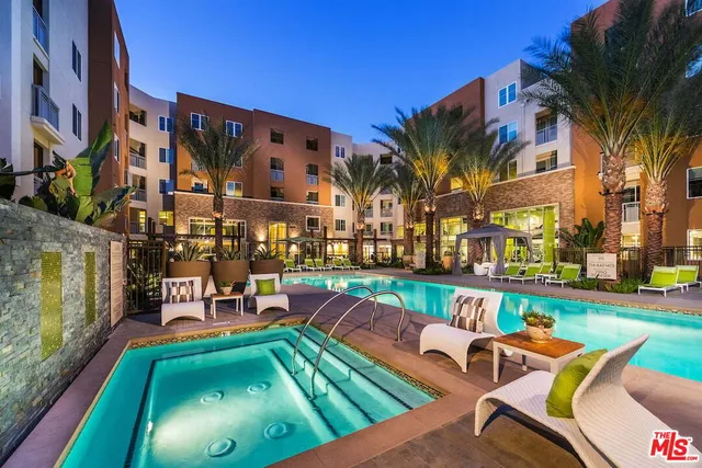 a view of swimming pool with outdoor seating