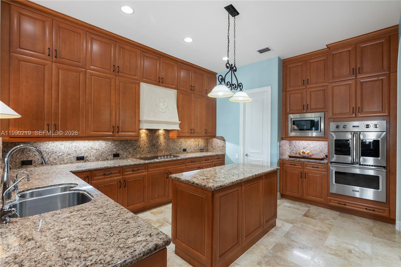 1495 Windjammer Way Hollywood, FL 33019 - Photo 13 of 48 a kitchen with stainless steel appliances granite countertop a sink stove and refrigerator