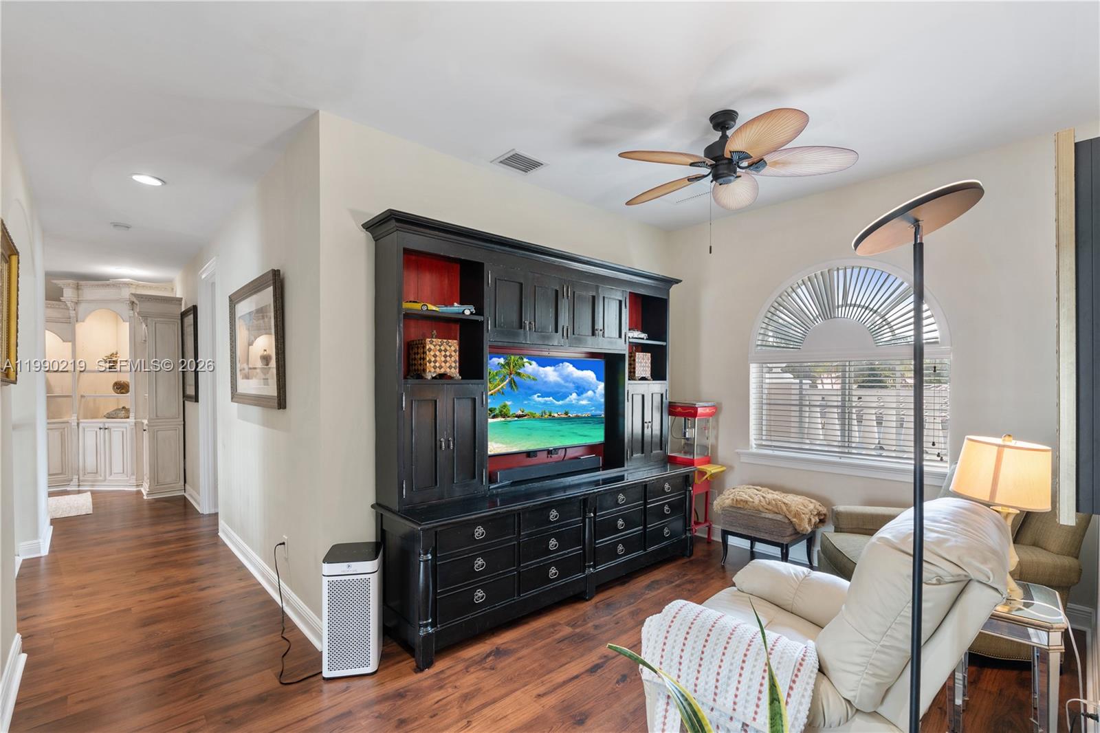 1495 Windjammer Way Hollywood, FL 33019 - Photo 21 of 48 a living room with furniture and a flat screen tv
