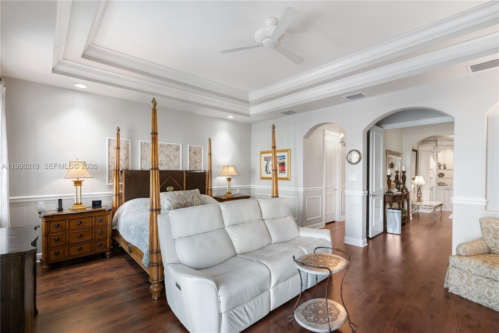 1495 Windjammer Way Hollywood, FL 33019 - Photo 25 of 48 a living room with furniture a rug and a chandelier