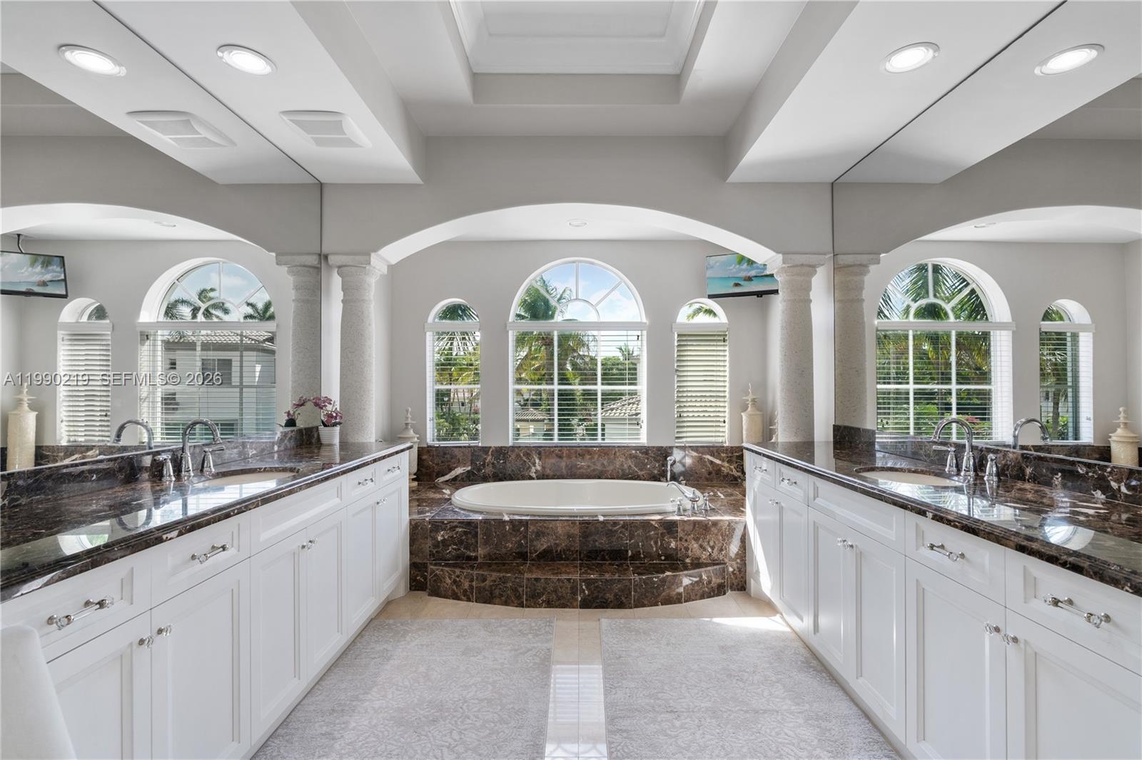1495 Windjammer Way Hollywood, FL 33019 - Photo 28 of 48 a large spacious bathroom with a large window and sink