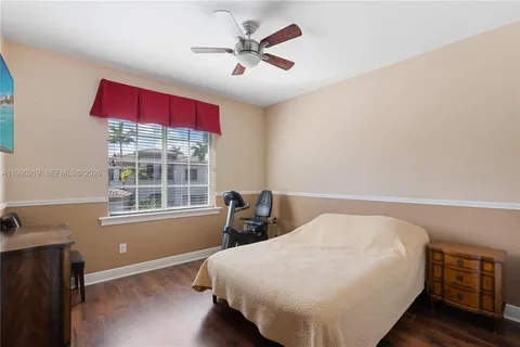 a bedroom with bed and window