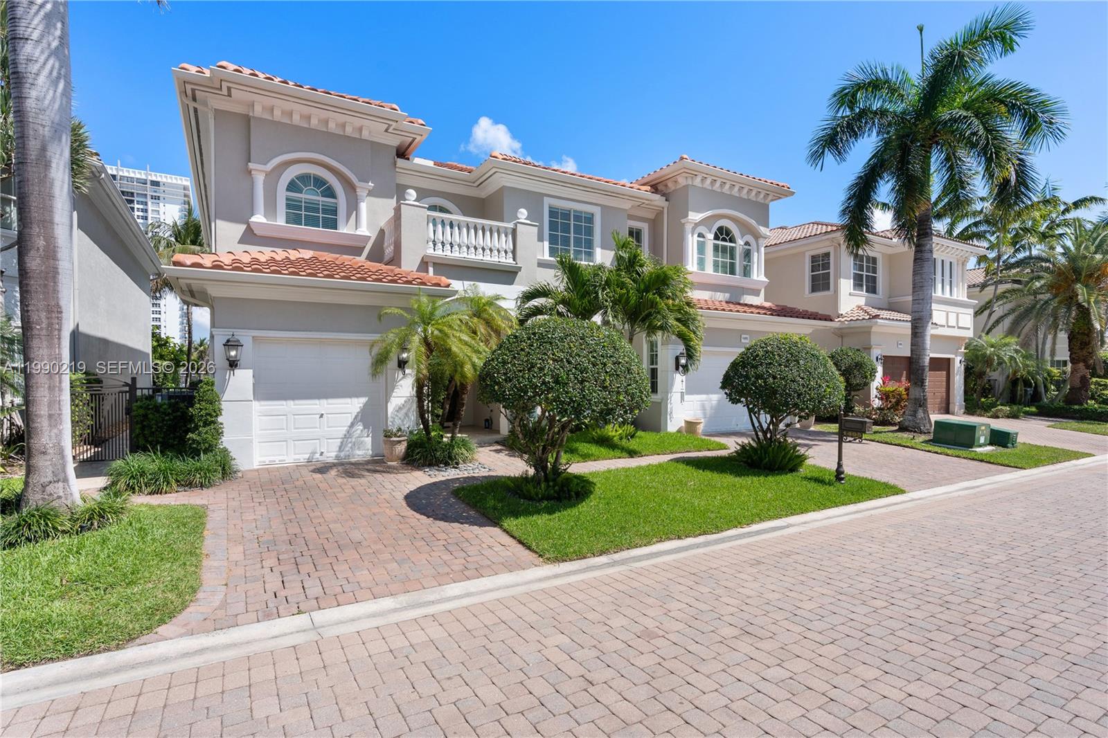 1495 Windjammer Way Hollywood, FL 33019 - Photo 42 of 48 a front view of a house with garden and trees