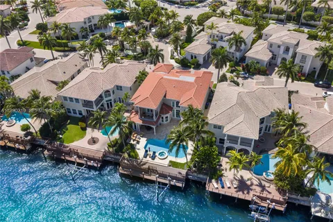 an aerial view of a houses with yard