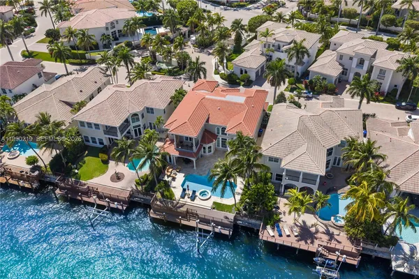 an aerial view of a houses with yard