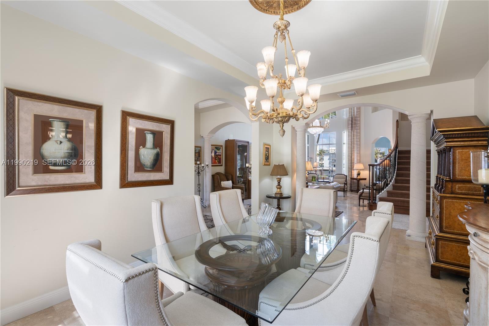 1495 Windjammer Way Hollywood, FL 33019 - Photo 10 of 48 a living room with furniture and a chandelier