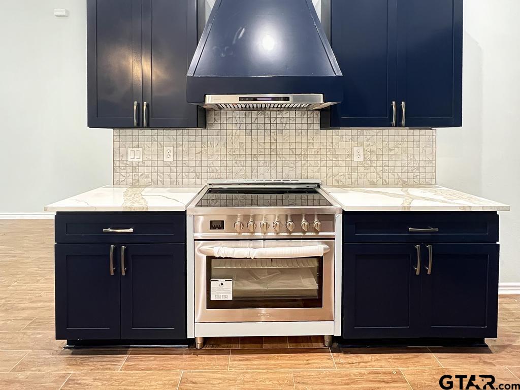 9143 Long Branch Tyler, TX 75703 - Photo 14 of 26 a kitchen with granite countertop a stove and a sink
