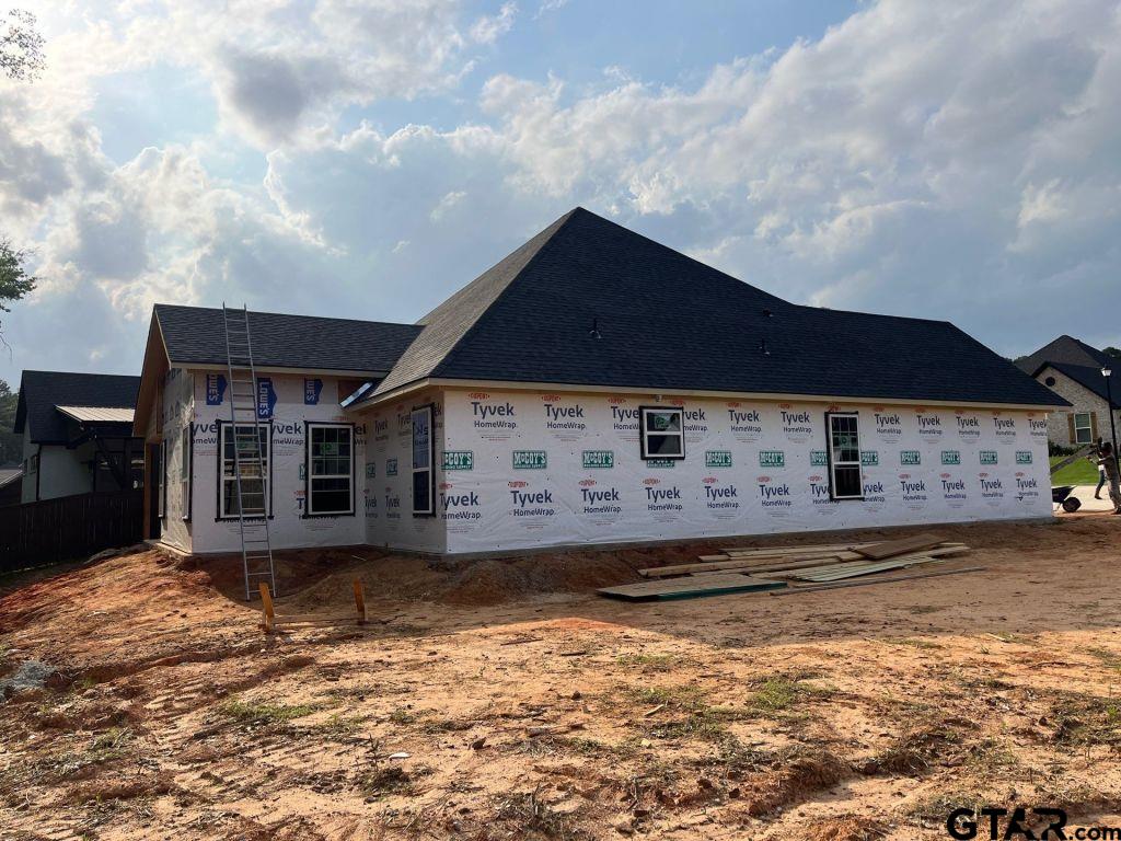 9143 Long Branch Tyler, TX 75703 - Photo 5 of 26 a front view of a house with a yard
