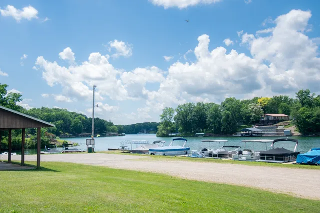 a view of a swimming pool and a yard