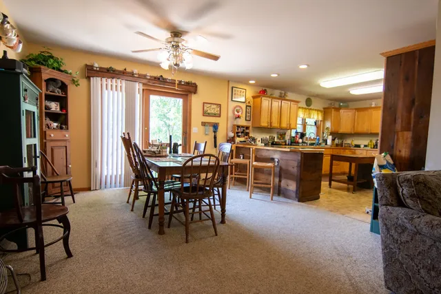 a view of a dining room with furniture window and outside view