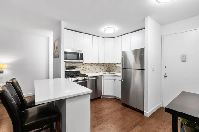 a large bedroom with a bed and a television