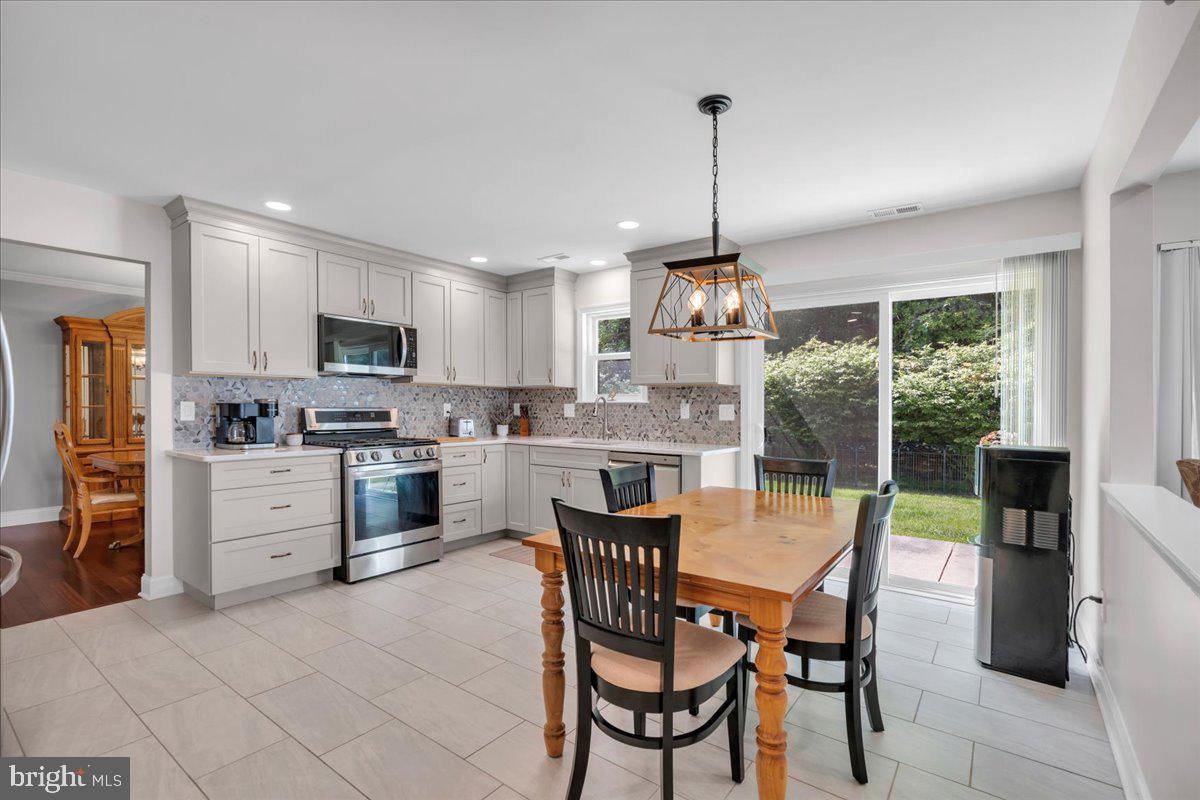 17 Vassar Road Mount Laurel, NJ 08054 - Photo 11 of 33 a kitchen with appliances cabinets and chairs