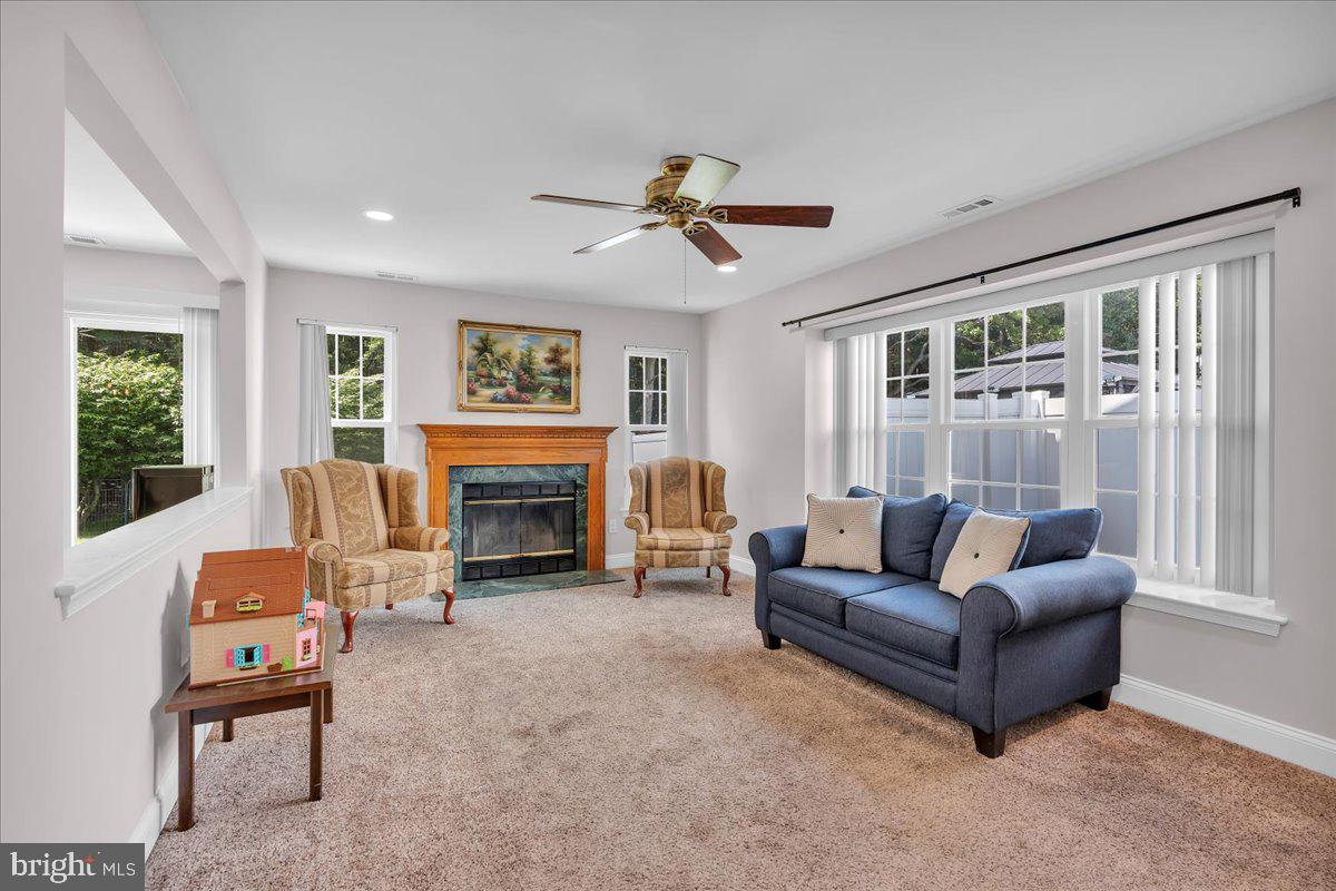 17 Vassar Road Mount Laurel, NJ 08054 - Photo 12 of 33 a living room with furniture a fireplace and a large window