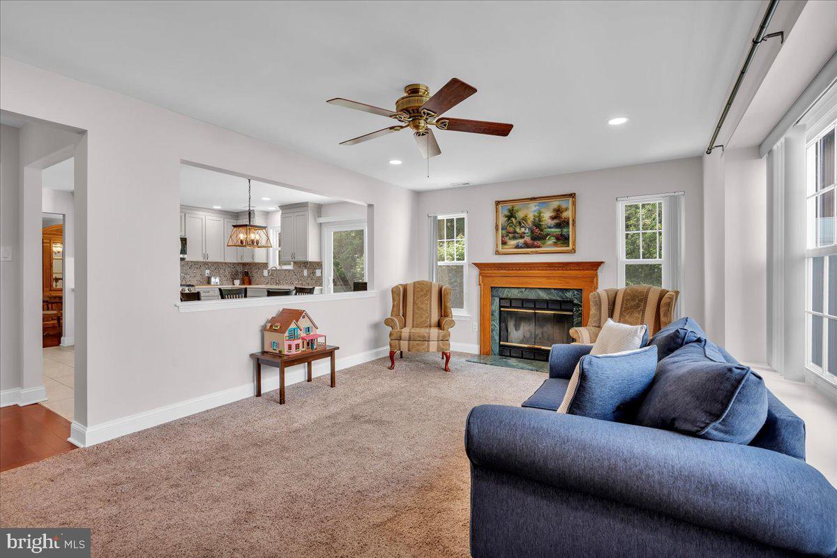 17 Vassar Road Mount Laurel, NJ 08054 - Photo 13 of 33 a living room with furniture a fireplace and a large window