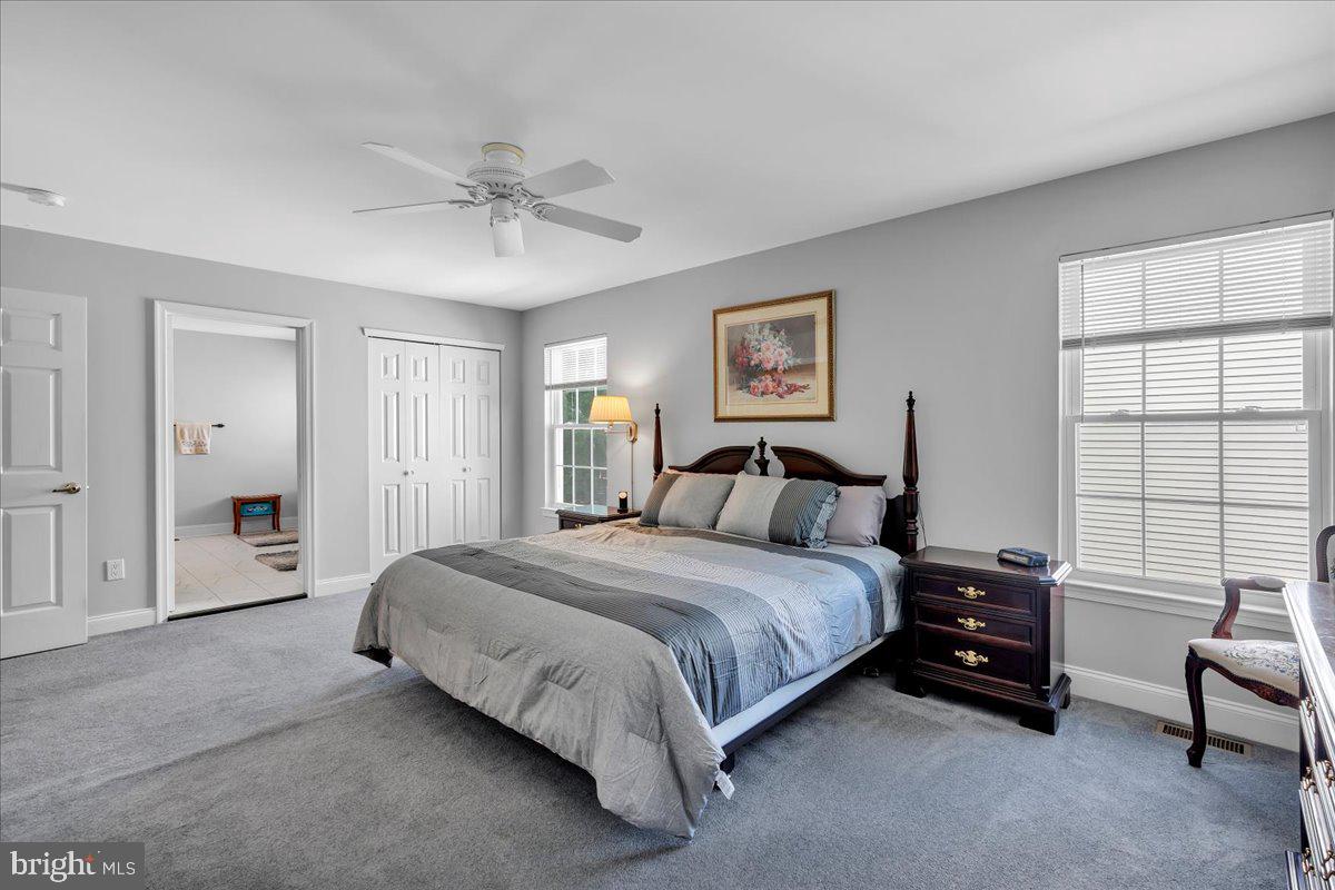 17 Vassar Road Mount Laurel, NJ 08054 - Photo 19 of 33 a spacious bedroom with a bed and a chandelier