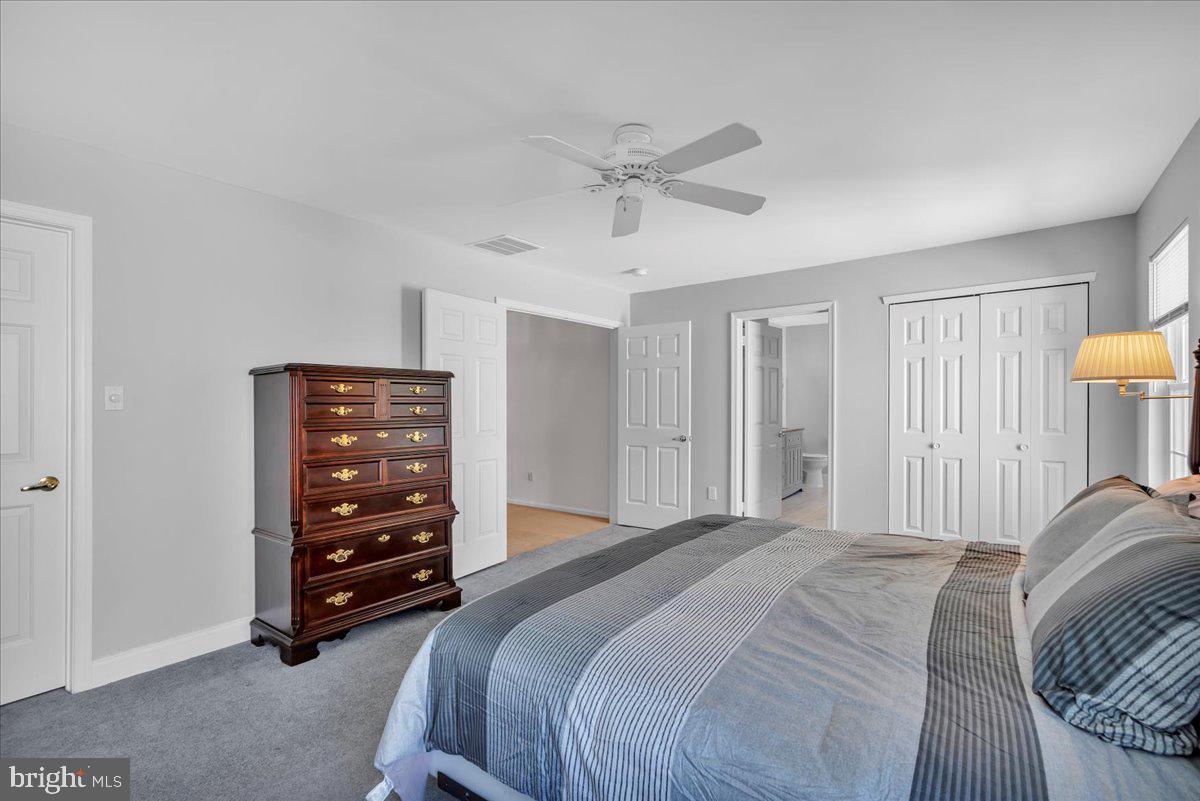 17 Vassar Road Mount Laurel, NJ 08054 - Photo 20 of 33 a bedroom with a bed and a lamp on the dresser