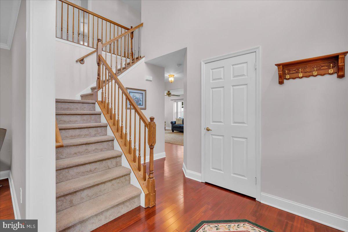 17 Vassar Road Mount Laurel, NJ 08054 - Photo 5 of 33 a view of staircase with wooden floor and a rug