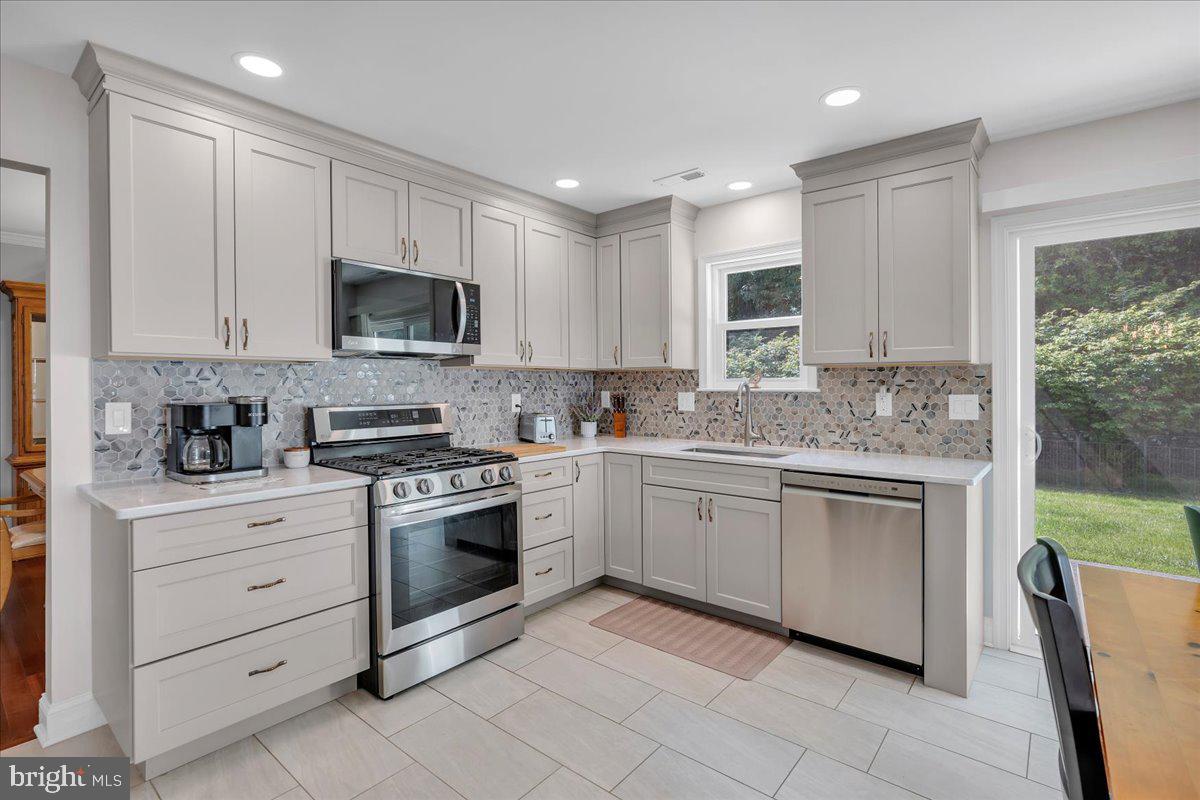 17 Vassar Road Mount Laurel, NJ 08054 - Photo 8 of 33 a kitchen with cabinets stainless steel appliances and a window
