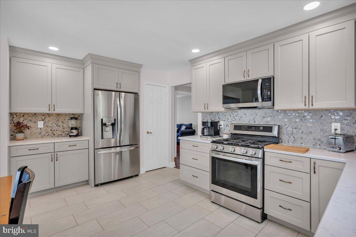 17 Vassar Road Mount Laurel, NJ 08054 - Photo 9 of 33 a kitchen with white cabinets and stainless steel appliances