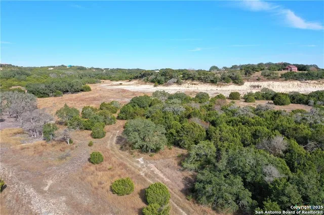 an aerial view of beach with ocean view