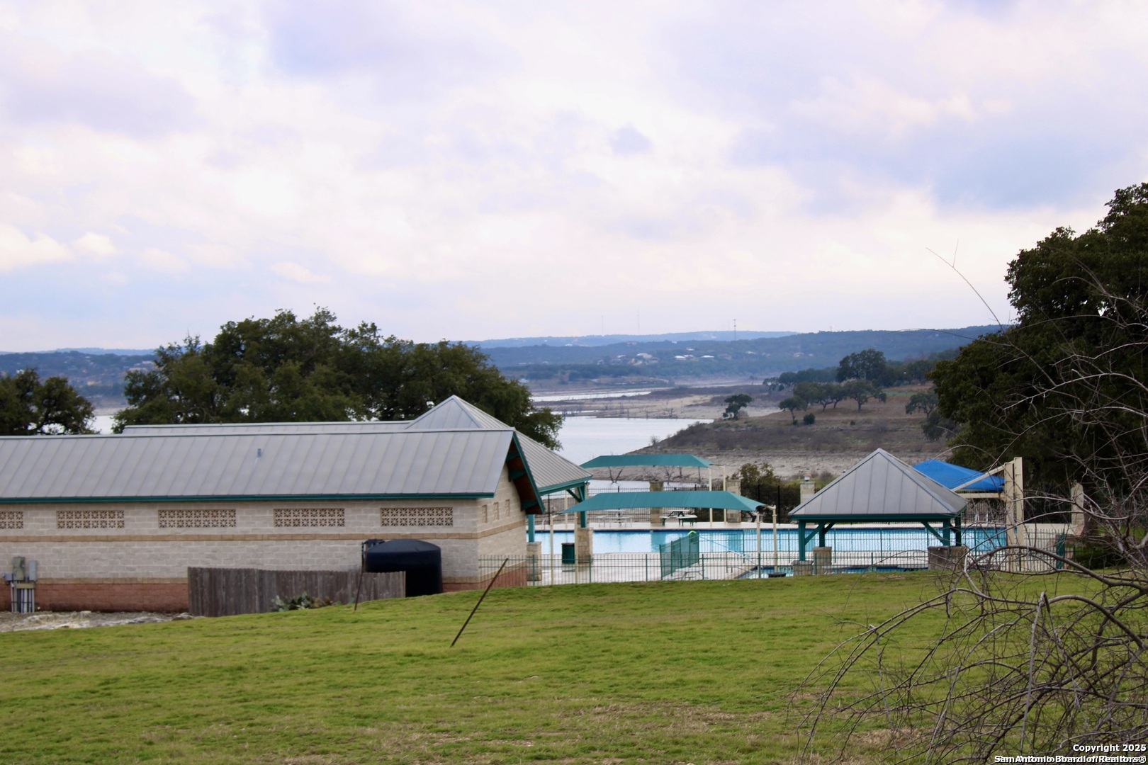 111 Dodder Lane Spring Branch, TX 78070 - Photo 4 of 16 an aerial view of a house with a garden and lake view