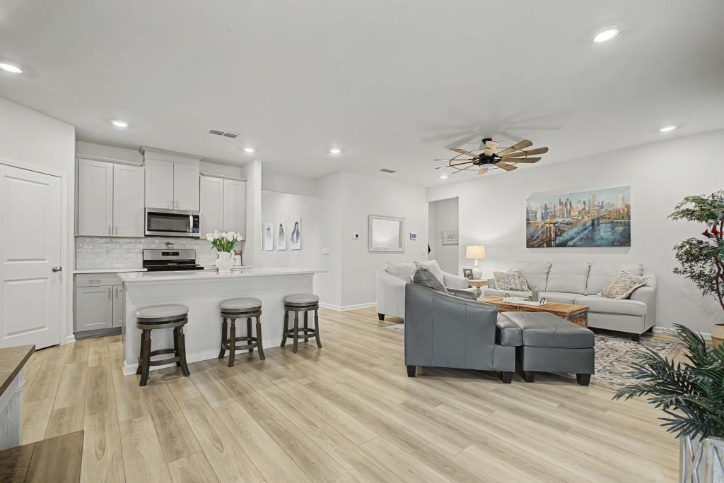 87 Cranson Walk Pendergrass, GA 30567 - Photo 19 of 50 a living room with furniture and a wooden floor