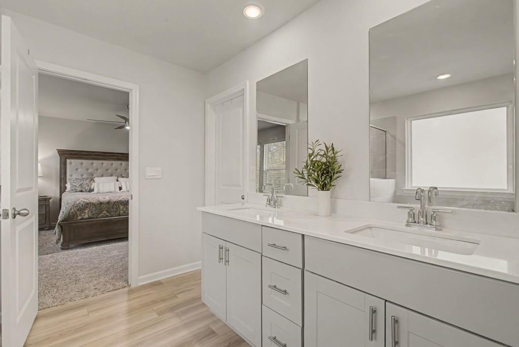 87 Cranson Walk Pendergrass, GA 30567 - Photo 32 of 50 a en suite bathroom with double sink and a mirror