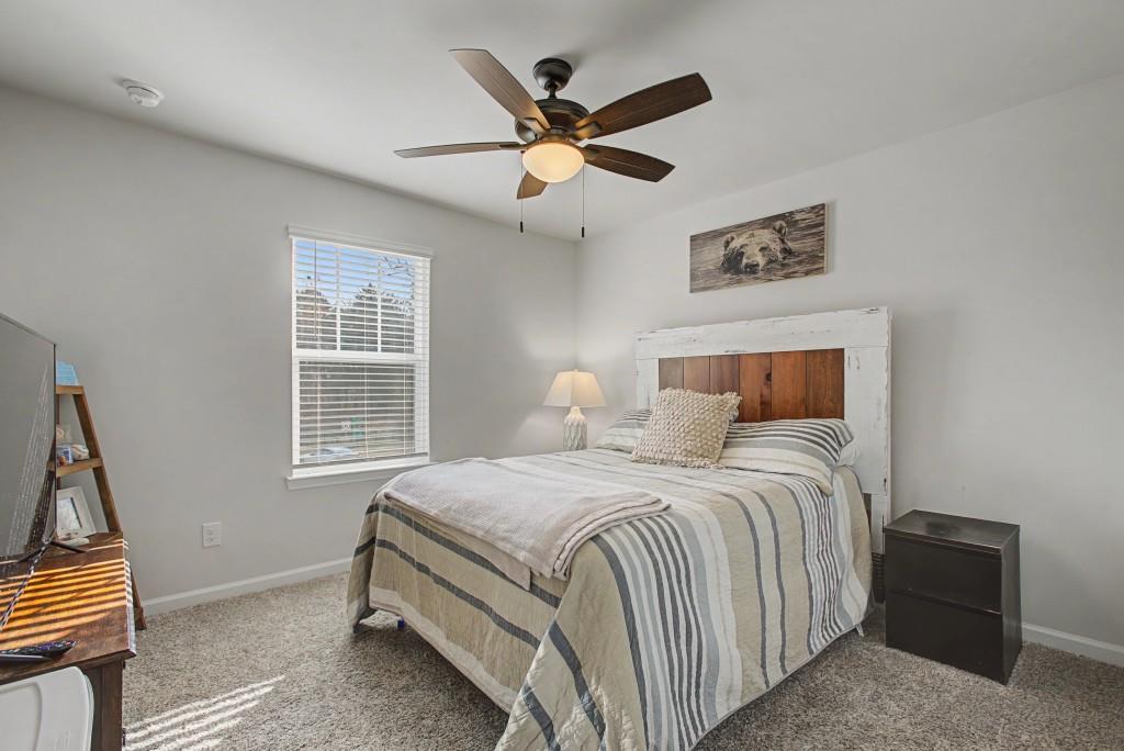 87 Cranson Walk Pendergrass, GA 30567 - Photo 36 of 50 a bedroom with a bed and a window