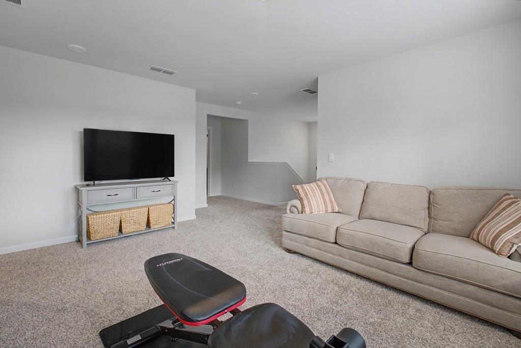 87 Cranson Walk Pendergrass, GA 30567 - Photo 43 of 50 a living room with furniture and a flat screen tv