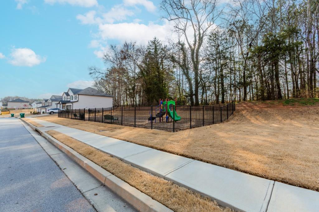 87 Cranson Walk Pendergrass, GA 30567 - Photo 49 of 50 a view of a street with houses