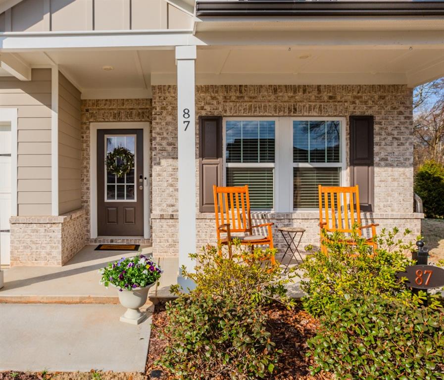 87 Cranson Walk Pendergrass, GA 30567 - Photo 5 of 50 a front view of a house with a large window